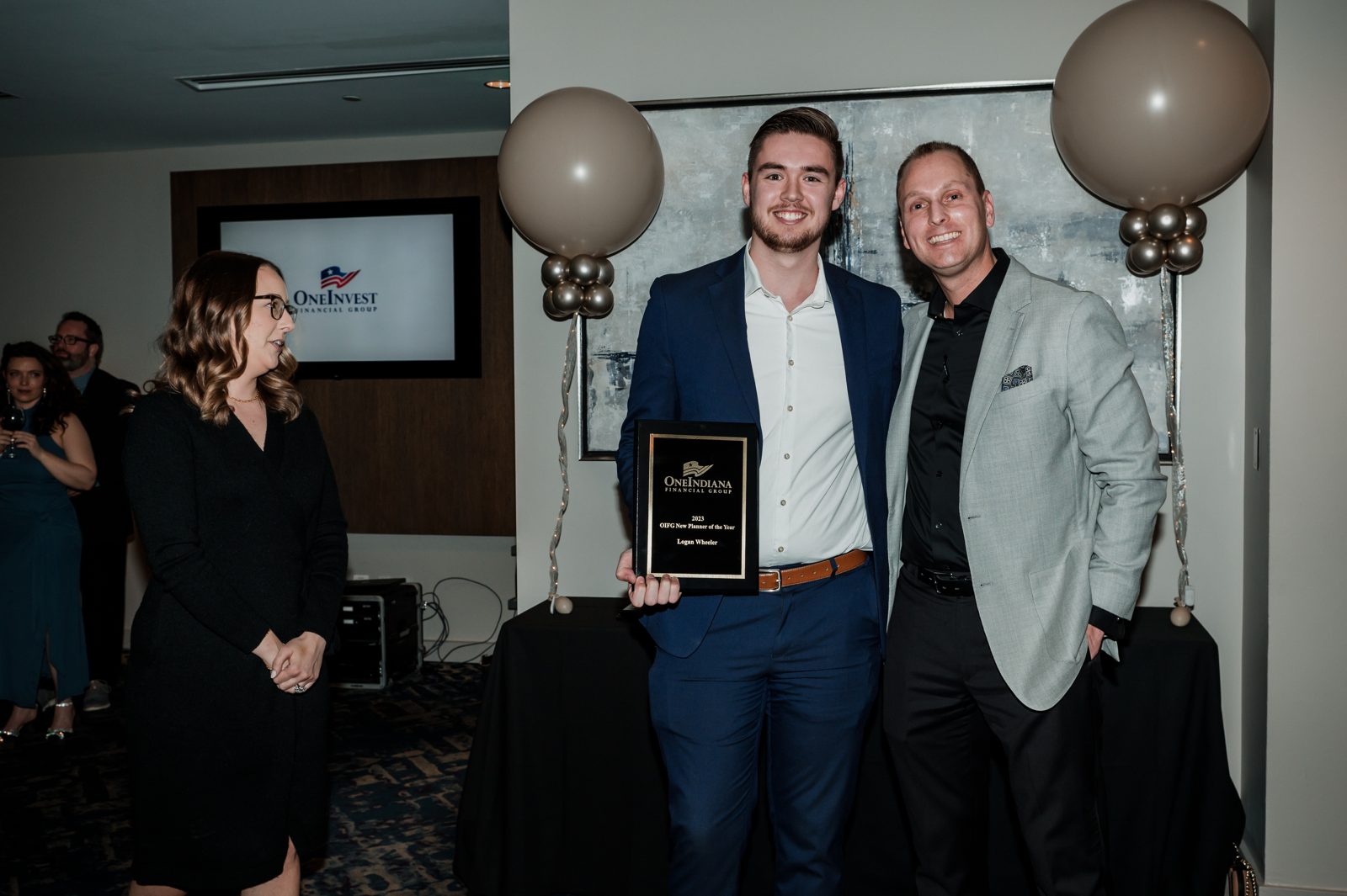 Logan receiving the 2023 New Planner of the Year award